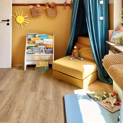 Experienced flooring installer laying engineered hardwood in a contemporary home