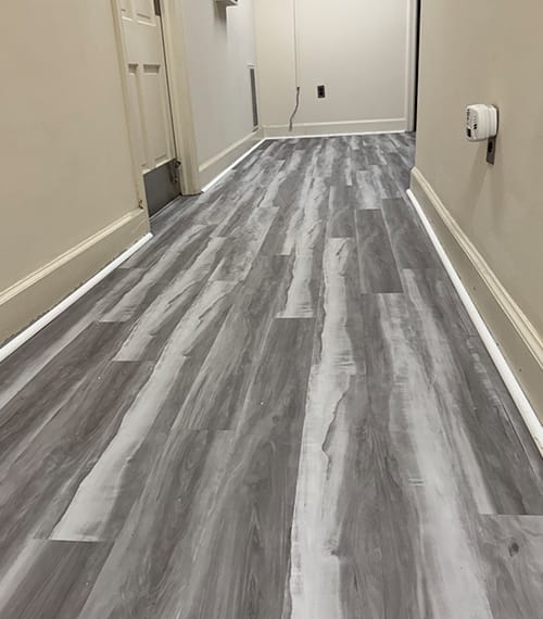 Luxury Vinyl Tile (LVT) offers the high-end appearance of ceramic or stone tile, paired with advanced vinyl construction that provides durability, water resistance, and comfort underfoot.