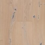 Close-up view of NEW WHITE BLACK PUTTY flooring showing unique finish details