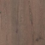 Close-up view of GRAY PEPPER RUSTIC flooring showing unique design and finish details