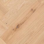 Close-up view of HERRINGBONE RUSTIC flooring showing detailed pattern and surface texture