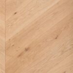 Close-up view of CHEVRON 45° NATURE flooring showing geometric design details