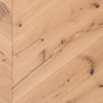 Close-up view of CHEVRON 45° RUSTIC flooring showing detailed geometric pattern
