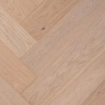 Close-up of HERRINGBONE NATURE CW WC A flooring showing detailed surface texture and pattern