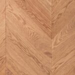 Close-up of CHEVRON 45° HONEY NATURE flooring showing premium surface texture and chevron design