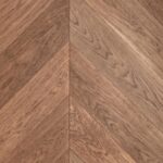 Close-up of CHEVRON 45° NUGAT SELECT flooring showing premium surface texture and geometric design